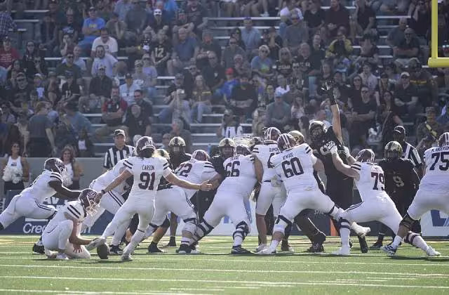 Full color game action photo of The U.S. Military Academy Army Football team, representing the 7th Infantry Division, takes on the University of Massachusetts Minutemen at Michie Stadium, West Point, N.Y., October 28, 2023. (U.S. Army Photo by John Pellino/USMA)