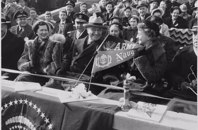 b/w Photograph of President Truman and his daughter Margaret with other spectators at the annual Army-Navy football game.