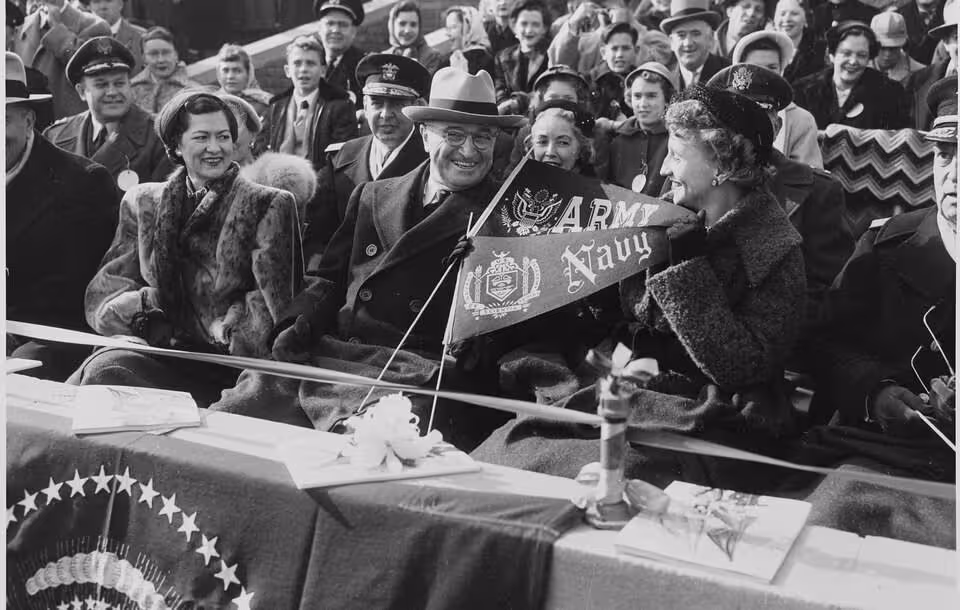 b/w Photograph of President Truman and his daughter Margaret with other spectators at the annual Army-Navy football game.