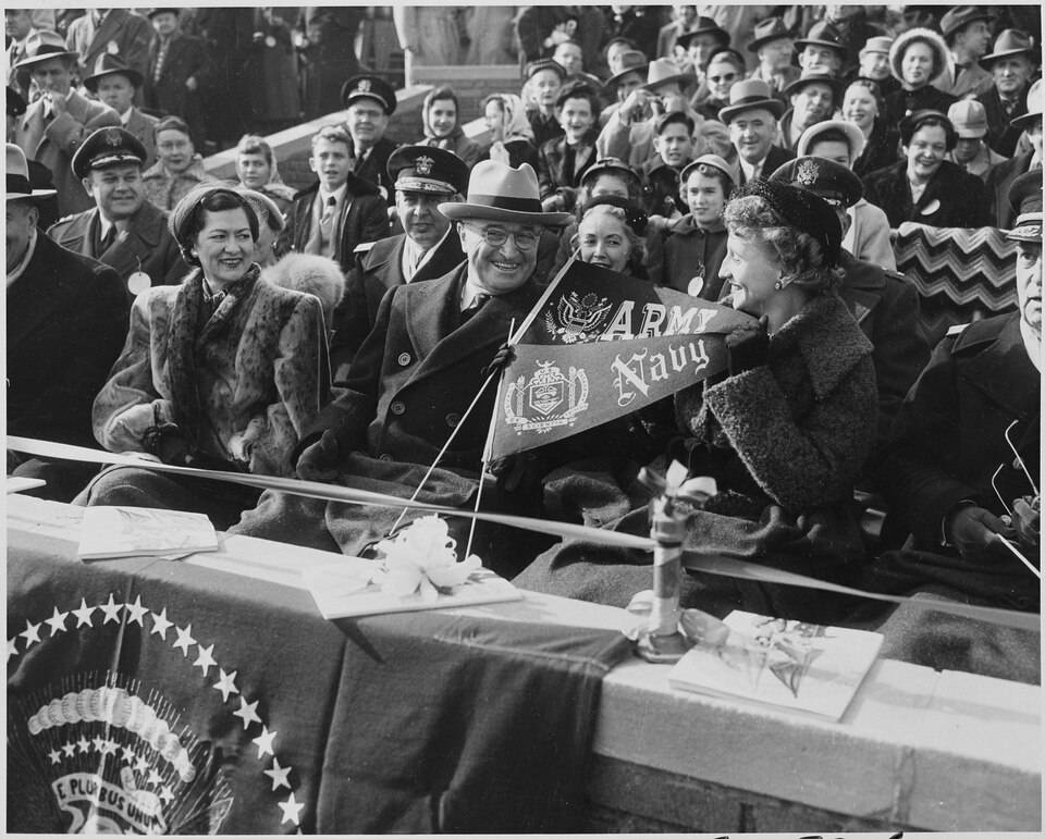 b/w Photograph of President Truman and his daughter Margaret with other spectators at the annual Army-Navy football game.
