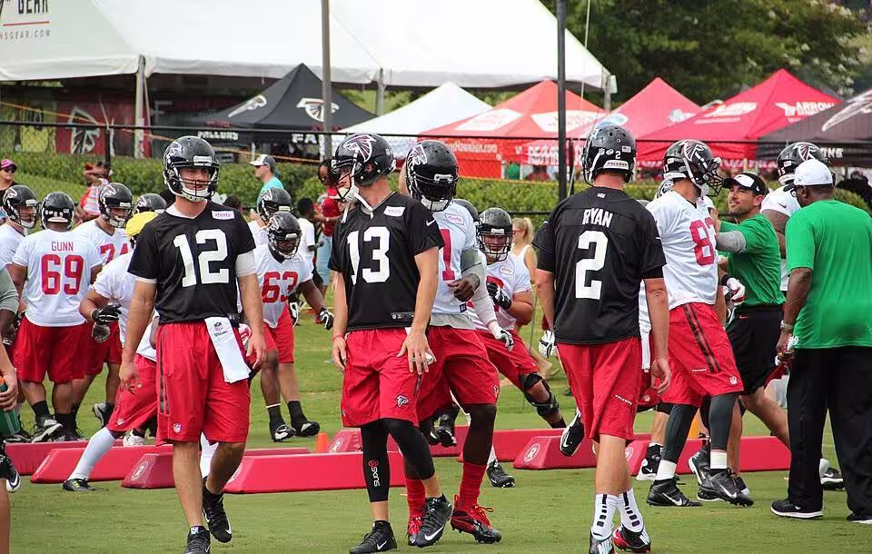 Color photo of Atlanta Falcons 2015 training camp, with (#12), TJ Yates (#13) and Matt Ryan (#2).