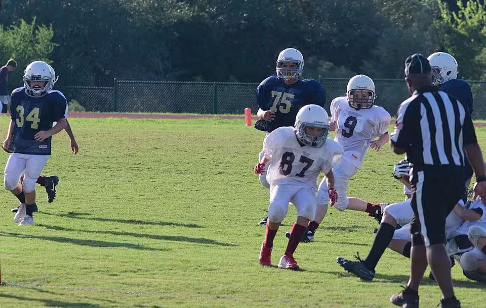 Color game day image, No doubt a proud father at a youth game on September 26, 2018, taking this snap shot called Will playing football 092618 uploaded to Wikimedia Commons by John Champion.