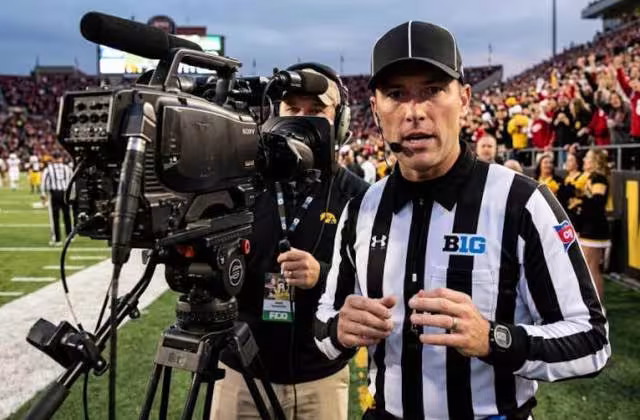 Gemini AI-created image of Big Ten Ref talking to TV camera.