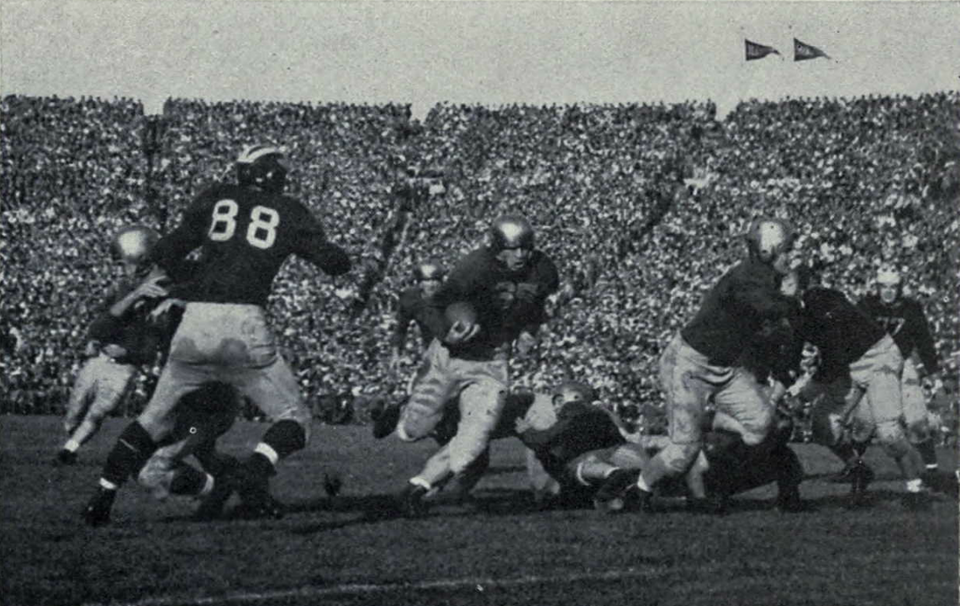 Vintage black and white game action photo of Creighton Miller against Michigan during the October 1943 game. via a kind uploader to Wikimedia Commons who shared it.