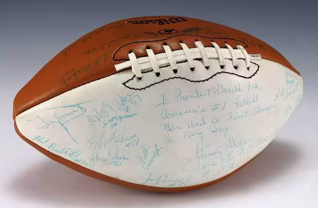 A signed University of Pittsburgh football and includes signatures from coach Johnny Majors, the Heisman Trophy winner from that year, Tony Dorsett, and the rest of the 1976 team. The football also includes an inscription to Ford which is featured on the white panel of the football.
