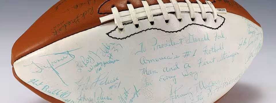 A signed University of Pittsburgh football and includes signatures from coach Johnny Majors, the Heisman Trophy winner from that year, Tony Dorsett, and the rest of the 1976 team. The football also includes an inscription to Ford which is featured on the white panel of the football.