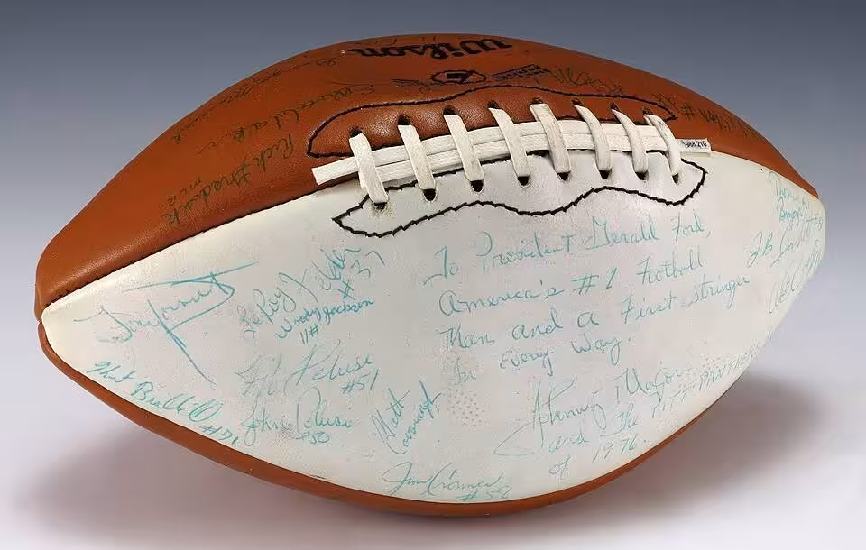 A signed University of Pittsburgh football and includes signatures from coach Johnny Majors, the Heisman Trophy winner from that year, Tony Dorsett, and the rest of the 1976 team. The football also includes an inscription to Ford which is featured on the white panel of the football.