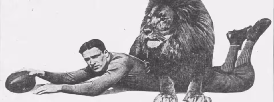 Promotional image in black and white of George Wilson and a Lion.