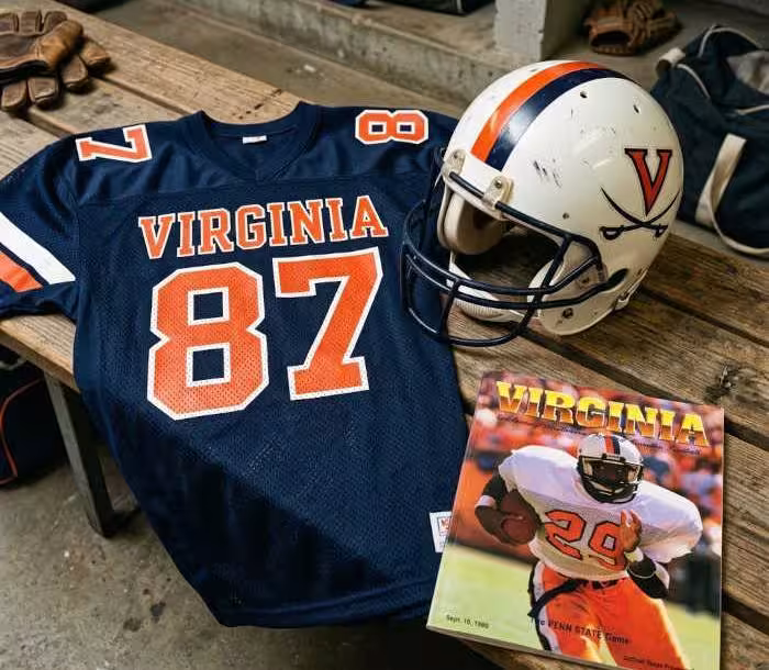 Gemini AI-created image of a 1988-era University of Virginia American football jersey 87 jersey, without a name on it, and a matching period-correct helmet, the program cover appropriate to the era and team.